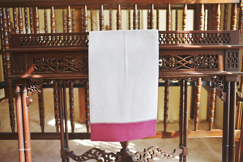 White Hemstitch Guest Towel with Pink Flambe Colored Border.